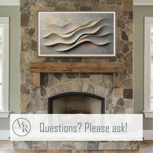 May include: A rectangular wall art piece featuring a series of layered, cream-colored, wave-like forms set against a muted, textured background of soft grays and tans, all enclosed within a simple, thin, light-toned wooden frame.