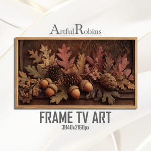 Könnte beinhalten: Gerahmtes Frame TV Art-Stück mit einer detaillierten Anordnung von Herbstblättern, Eicheln und Tannenzapfen in Braun-, Rot- und Goldtönen. Das Kunstwerk ist vor einem dunklen Holzgrund platziert, mit dem Text "Artful Robins" und "FRAME TV ART".