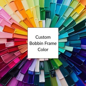 May include: A colourful display of paint swatches in a rainbow pattern. The text "Custom Bobbin Frame Color" is in the centre of the image.