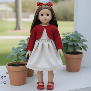 May include: A doll wearing a red bolero jacket, a white dress, and red shoes. The doll has long brown hair and a red bow. The text "BERRY BASIC" is at the bottom left of the image. The doll is standing near potted plants.