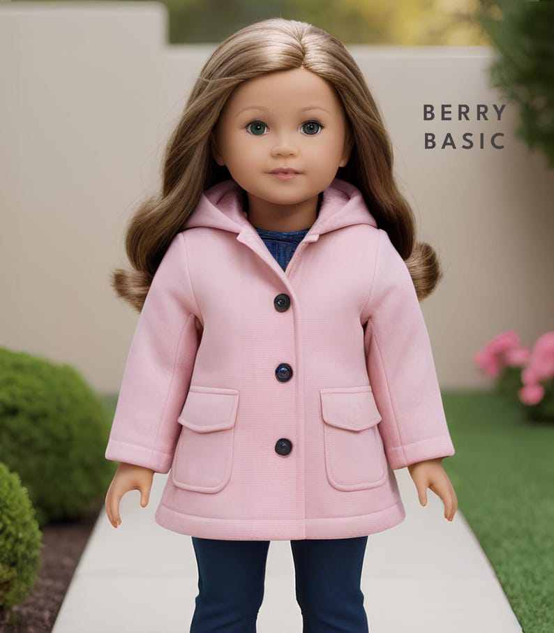 May include: A pink hooded coat with a button closure and two front pockets. The coat is made for a doll and has the text "BERRY BASIC" on the right side of the image.