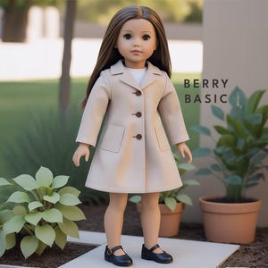 May include: A beige doll wearing a long-sleeved beige coat with brown buttons and black shoes. The doll has long brown hair and blue eyes. The text "BERRY BASIC" is visible in the background.