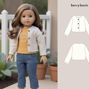 May include: A doll wearing a white cardigan, a yellow shirt with the word "Friends" on it, and blue jeans. A line drawing of a white cardigan with buttons is shown on the right side of the image. The text "berry basic" is above the drawing.