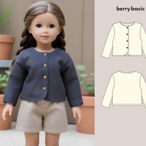 May include: A dark blue cardigan with a button closure and long sleeves. The cardigan is shown on a doll wearing a pair of beige shorts. The image also includes a line drawing of the cardigan in two colors, white and cream.