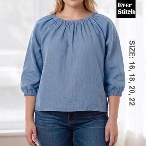 May include: A light blue blouse with a gathered neckline and three-quarter sleeves. The blouse is made of a textured fabric and is paired with blue jeans. The image includes the text "Ever Stitch" and size options: 16, 18, 20, 22.