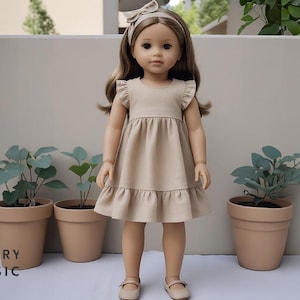 May include: A doll in a beige dress with frilled sleeves and hem, a matching headband, and beige shoes. The doll stands before three potted plants. The text "BERRY BASIC" is at the bottom left of the image.