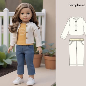 May include: A white cardigan with a button fastening and a pair of blue jeans. The outfit is designed for a doll. The text "berry basic" is in the top right corner of the image.