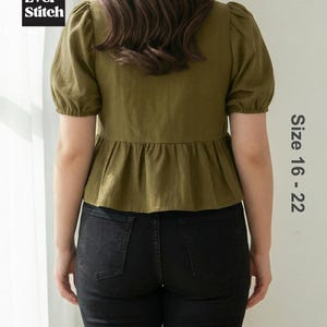 Plus-size model wearing an olive green, square-neck, short puff-sleeve top with a button-down front and peplum hem. Text reads Ever Stitch Size 16-22.