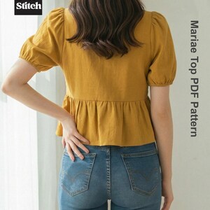 May include: Mustard yellow top with short, puffed sleeves and a peplum waist, paired with blue denim jeans. The image includes the text "Mariae Top PDF Pattern" and the "Ever Stitch" logo.