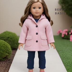 May include: A pink hooded coat with a button closure and two pockets. The coat is being worn by a doll with brown hair and blue eyes. The doll is wearing blue jeans and pink shoes. The text "BERRY BASIC" is visible in the background.