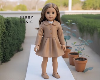 May include: A doll wearing a brown coat with a white collar and a white shirt underneath. The doll is wearing brown shoes and has long brown hair. The doll is standing on a white surface. The text "BERRY BASIC" is visible in the background.