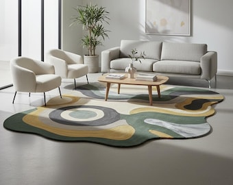 May include: A modern living room featuring a large, abstract area rug with a green, yellow, and gray pattern. The room includes a gray sofa, two cream-colored armchairs, and a wooden coffee table. A potted plant and artwork complete the decor.