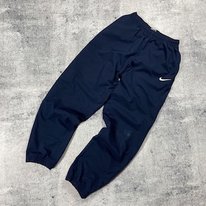 navy blue nike windbreaker pants