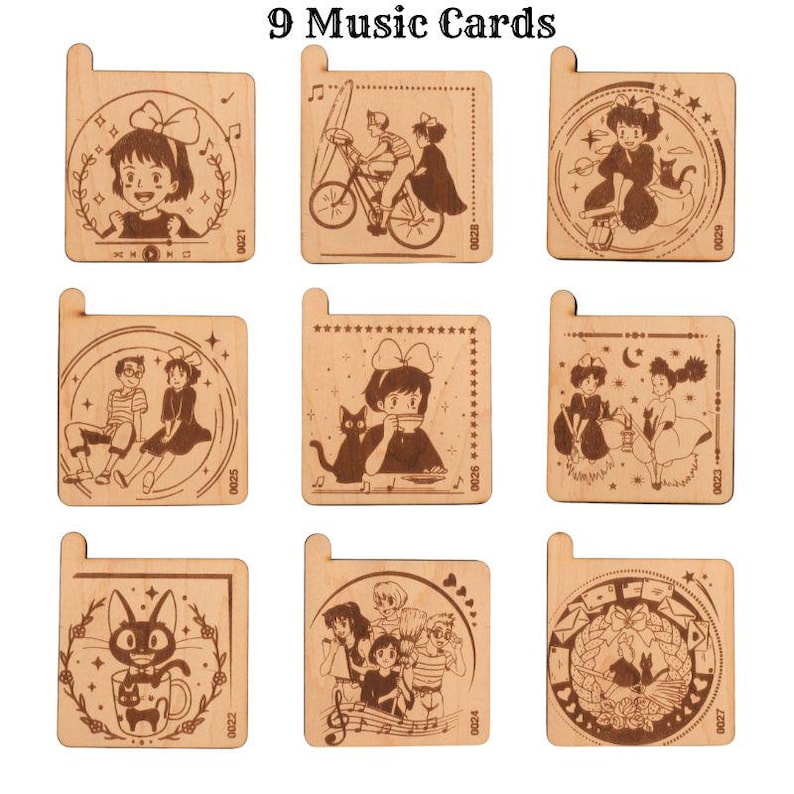 May include: Nine wooden music cards featuring characters from the animated film 'Kiki's Delivery Service'. Each card has a different illustration and is decorated with stars, hearts, and musical notes.
