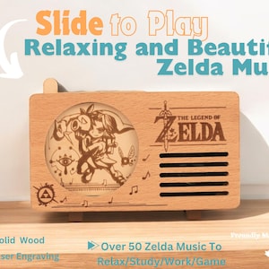 May include: A wooden music box with a slide to play feature. The box is decorated with a laser engraved image of Link and Zelda from The Legend of Zelda video game. The text "The Legend of Zelda" is also engraved on the box. The box is made of solid wood and is proudly made in Canada.