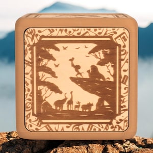 Boîte à musique Tap-to-Play Le Roi Lion | Jouez à Peux-tu sentir l'amour ce soir et Le lion dort ce soir | Cadeau parfait pour les fans et les enfants