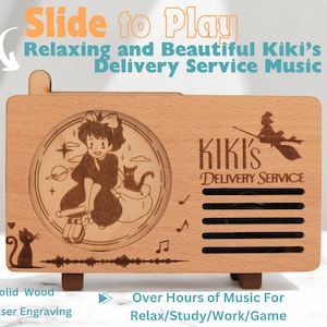 May include: A wooden music box with a sliding lid. The lid features a laser engraved image of Kiki from Kiki's Delivery Service. The music box is made of solid wood and has a speaker on the front. The text "Kiki's Delivery Service" is engraved on the front of the music box.