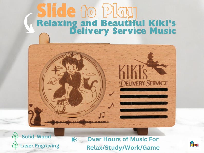 May include: A wooden music box with a sliding lid. The lid features a laser engraved image of Kiki from Kiki's Delivery Service. The music box is made of solid wood and has a speaker on the front. The text "Kiki's Delivery Service" is engraved on the front of the music box.
