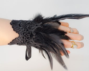 Pair of black feather and lace cuffs
