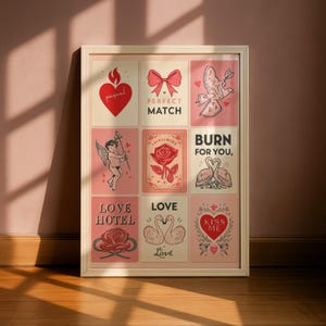 May include: Framed art print featuring nine romantic illustrations on pink backgrounds. The images include hearts, bows, doves, roses, and cherubs, with phrases like "Perfect Match" and "Kiss Me". The artwork is in a vintage style.