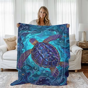 May include: A blue and purple sea turtle with gold accents swims through a swirling blue and white ocean. The turtle's shell is filled with a galaxy of stars.