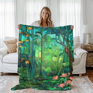 May include: A forest-themed blanket with a stained-glass effect. The design features tall trees, a pond with pink flowers, and orange-colored mushroom-like plants. The color palette includes shades of green, blue, and yellow.