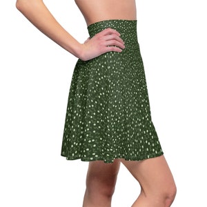 May include: A green skater skirt with a white floral pattern. The skirt has an elastic waistband and a flared silhouette.