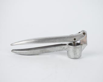 Vintage knoflookpers, vintage knoflookstamper, handknoflookpers, metalen notenkraker, keukengerei, kookaccessoire, retro decor
