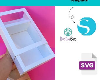 May include: White cardboard box with a clear plastic window, featuring two compartments. The box is designed for packaging and displaying products. The image includes the text "Template" and "Blank Template Plantilla en Blanco".