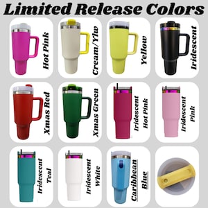 May include: A collection of insulated travel mugs in various colors, including hot pink, cream/yellow, yellow, black, red, green, and teal. Each mug has a handle and a lid. The text "Limited Release Colors" is at the top.