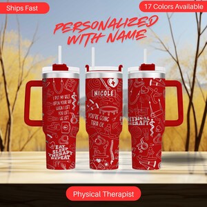May include: Red stainless steel tumbler with a white handle and a white lid. The tumbler is decorated with a white design of physical therapy related icons and the text "I put my belt upon your hip when I lift you lift we lift", "You're going tibia ok", "Eat sleep therapy repeat", and "Physical Therapy".