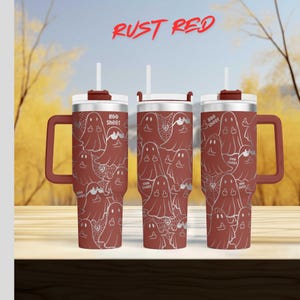 three red tumblers with a repeating pattern of ghost-like figures on their surfaces.