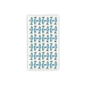 May include: A rectangular, off-white kitchen towel featuring a repeating pattern of stylized blue fish. The fish are arranged in rows and columns, creating a visually appealing design. The towel is likely made of absorbent material.