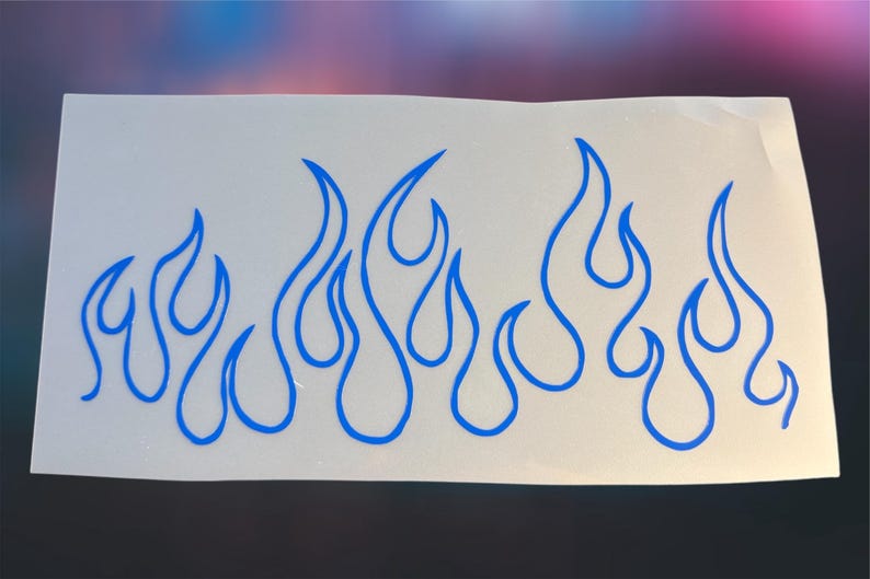 May include: A white sticker featuring a blue flame design. The flames are stylized with curved lines, creating a dynamic and energetic visual. The sticker is suitable for various applications, such as car decals or decorative accents.