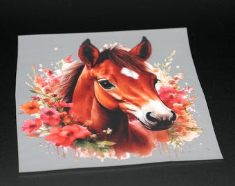 May include: A watercolor painting of a brown horse with a white star on its forehead. The horse is surrounded by red and orange flowers.