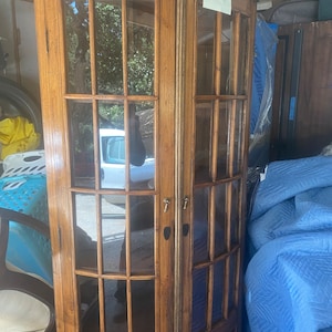 Two matching antique corner hutches