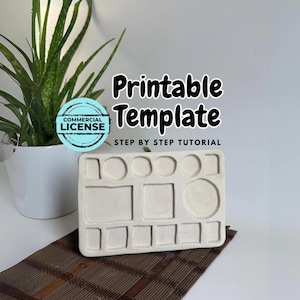 Puede incluir: Una plantilla rectangular beige con varias hendiduras con formas, incluyendo cuadrados, círculos y rectángulos. El texto "Printable Template" y "Step by Step Tutorial" son visibles. Una planta de aloe vera en maceta y una esterilla marrón están en el fondo.