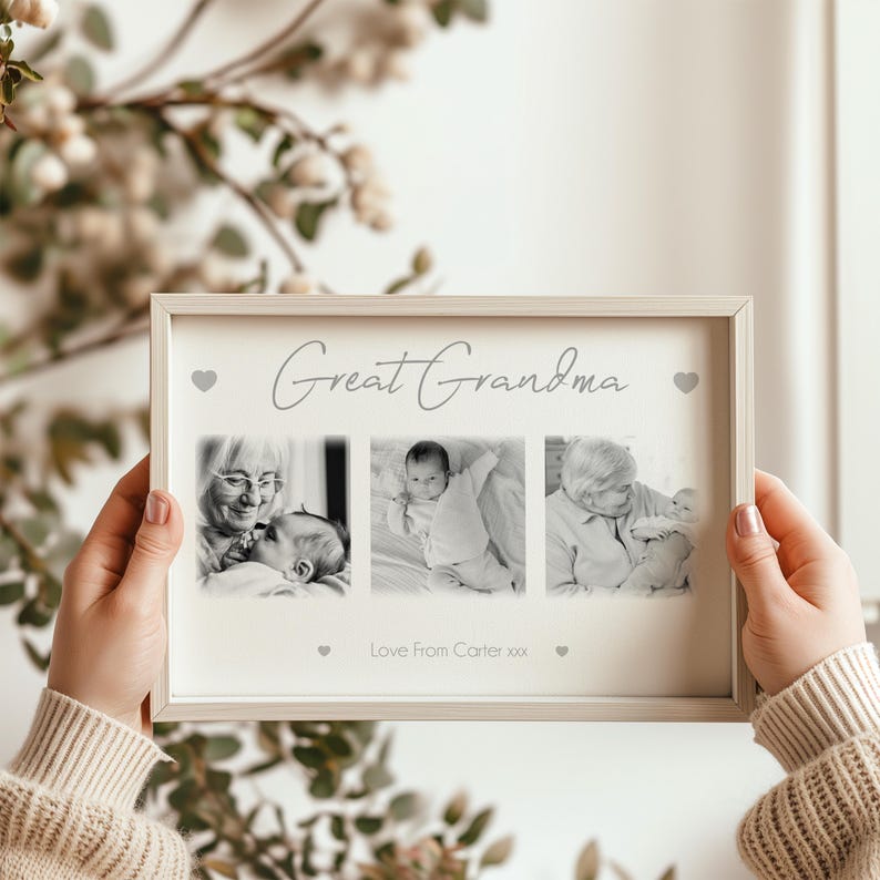 May include: A framed photo collage with three black and white images. The top of the frame reads "Great Grandma" in script. The bottom of the frame reads "Love From Carter xxx". The frame is held by a person.