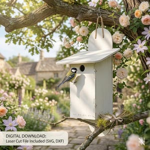 May include: A white wooden birdhouse with a small round entrance hole, hanging from a tree branch. A small bird perches on the side. The background features a garden with flowers and a building. Text on the image reads: DIGITAL DOWNLOAD: Laser Cut File Included (SVG, DXF).