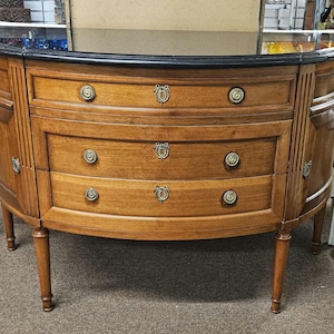 Louis XVI style demilune commode with polished black granite beveled top