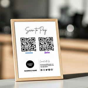 May include: A framed sign with the words "Scan to Pay" in elegant script. Below are two QR codes, one for Venmo and one for Zelle. The sign also includes a business logo, business name, and contact information.