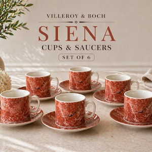 以下が含まれることがあります： Villeroy & Bochのシエナカップ＆ソーサー6客セット。カップとソーサーは赤い大理石のデザインです。カップは白い内側と小さなハンドルが付いています。ソーサーは丸く、カップとマッチしています。