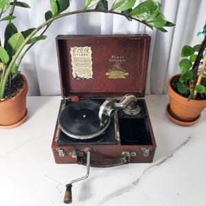 Gramófono portátil Pixia Grippa antiguo