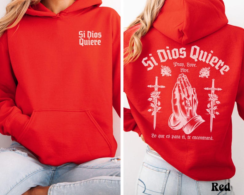 May include: Red hooded sweatshirt with the text "Si Dios Quiere" on the front and back. The back design includes praying hands, swords, and roses. The text on the back also includes "Pray, Love, Live" and "Lo que es para ti, te encontrar&aacute;."