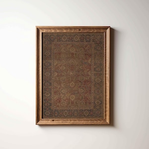 May include: A framed rectangular print featuring a detailed, antique-style rug design. The rug has a central field of brown and red with intricate floral patterns, framed by a dark blue border. The frame is made of light brown wood.