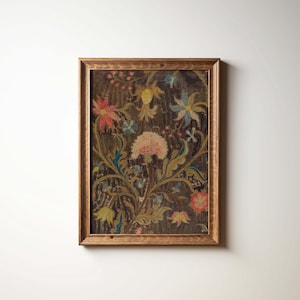 May include: A framed floral print with a dark background and a wooden frame. The print features colorful flowers in shades of pink, red, yellow, and blue, with green leaves and stems. The artwork is a vintage style.