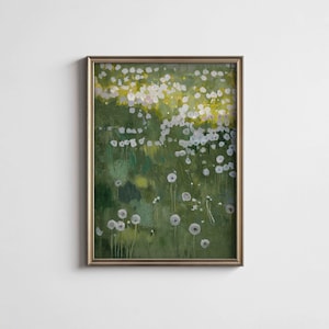 May include: An abstract painting of a field of white flowers against a green background. The artwork is framed in a gold-colored frame. The painting evokes a sense of nature and tranquility.