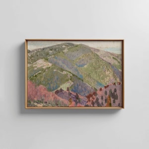 May include: An oil painting of a mountain landscape in a wooden frame. The artwork depicts rolling hills in shades of green, purple, and pink, with a light blue sky. The visible brushstrokes create a textured effect.
