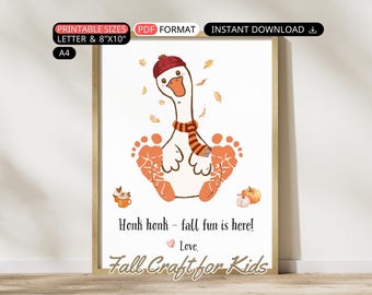 May include: A framed print featuring a cartoon goose with a red hat and scarf, surrounded by orange footprints. The print includes the text "Honk honk - fall fun is here!" and "Fall Craft for Kids."