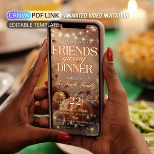 May include: A smartphone displaying a digital Friendsgiving dinner invitation template. The screen features text reading Friendsgiving Dinner, hosted by The Smith Family, with a pumpkin graphic, string lights, and event details.